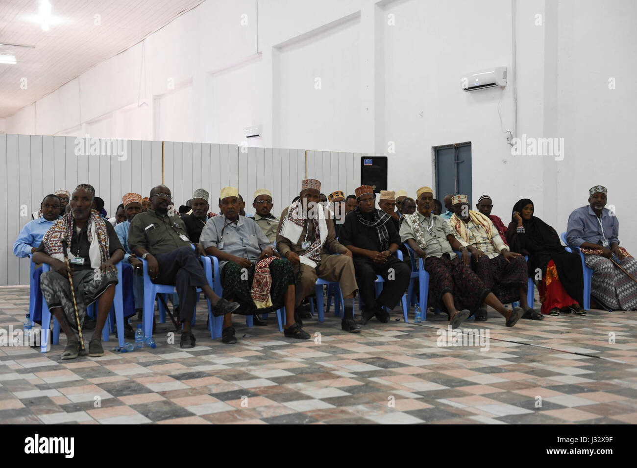 Delegates wait to vote during the electoral process to choose members of the Upper House of the  Federal Parliament in Mogadishu, Somalia on January 8, 2017. AMISOM Photo / Omar Abdisalan Stock Photo