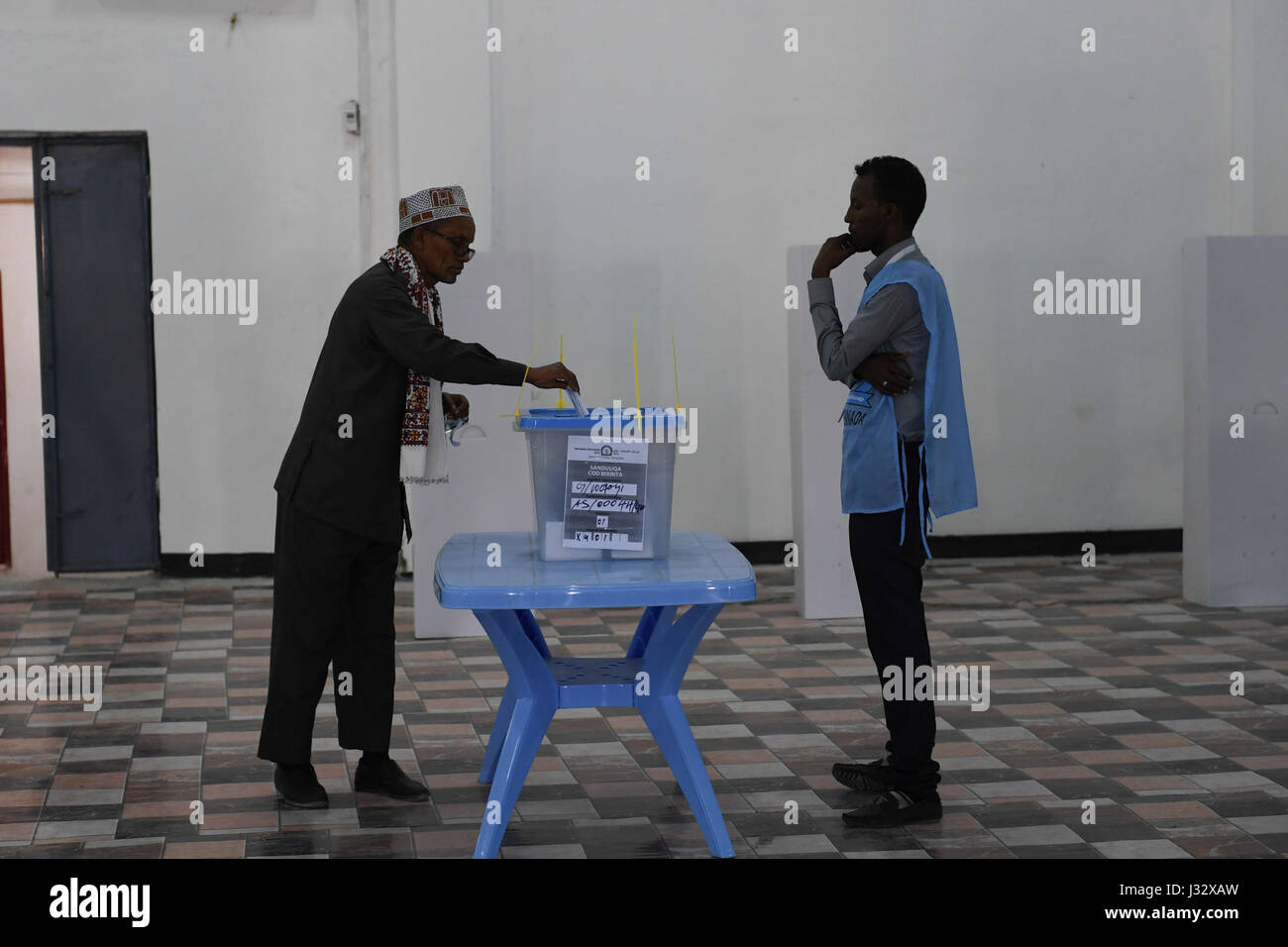A delegate from Somaliland votes during the electoral process to choose Somaliland's representatives to the Upper House of the Federal Parliament in Mogadishu, Somalia, on January 8, 2017. AMISOM Photo / Omar Abdisalan Stock Photo