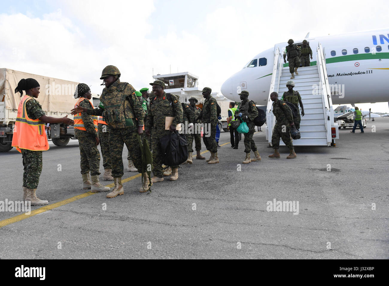 Newly deployed soldiers of the Uganda People’s Defence Forces (UPDF) arrive at Aden Abdulle International Airport on April 7, 2017. The troops are to serve under the African Union Mission in Somalia (AMISOM). AMISOM Photo/Omar Abdisalan Stock Photo