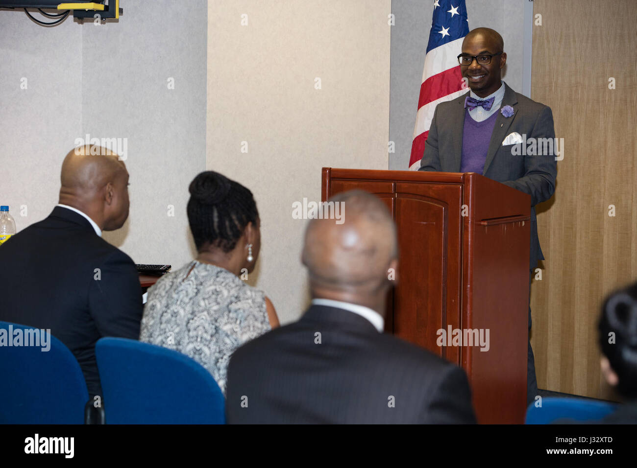 This image shows Craig Kenner, a Health and Fitness Specialist, speaking at the U.S. Customs and Border Protection's Martin Luther King Jr. program in Washington, D.C. The event emphasized volunteerism and the theme 'Remember, Celebrate, Act!' Stock Photo