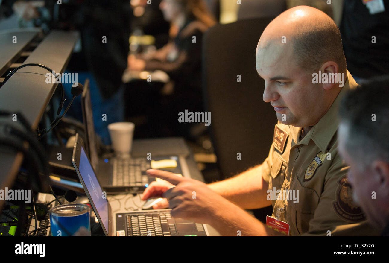 Air Interdiction Agent Craig Colquitt with the U.S. Customs and Border Protection, Air and Marine Operations, works alongside a contingent of local, state and federal law enforcement agencies at the Houston Police Department's emergency operations center to ensure security of Super Bowl LI Feb 3, 2017. U.S. Customs and Border Protection Photo by Glenn Fawcett Stock Photo