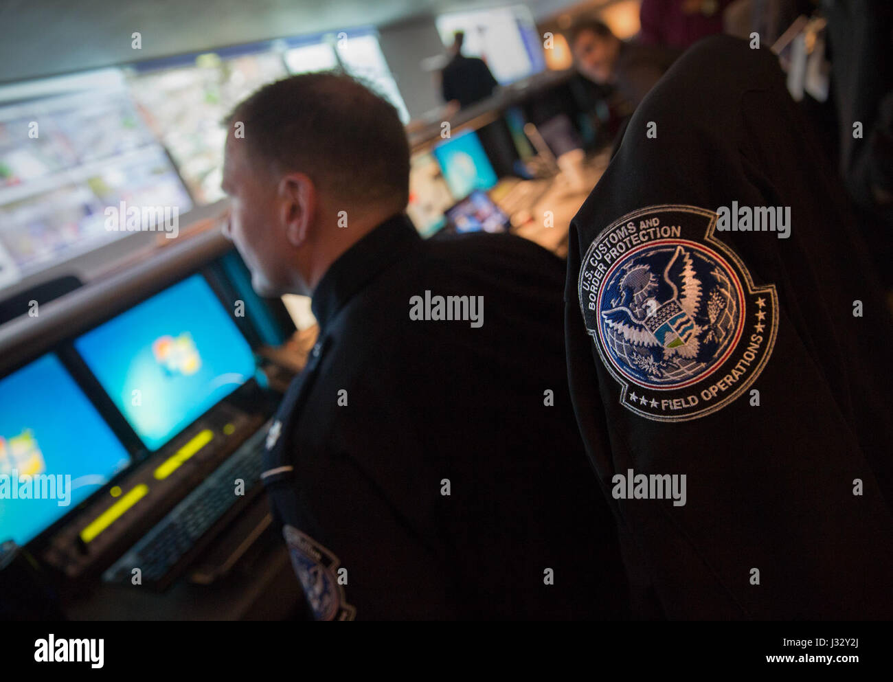 Officer Anthony Scafuri of U.S. Customs and Border Protection Office of Field Operations, works alongside a contingent of local, state and federal law enforcement agencies at the Houston Police Department's emergency operations center to ensure security of Super Bowl LI Feb 3, 2017.  U.S. Customs and Border Protection Photo by Glenn Fawcett Stock Photo
