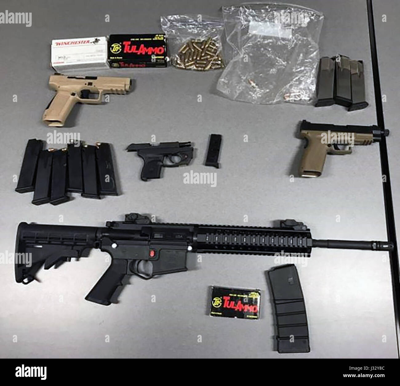 020317: SAN DIEGO - U.S. Customs and Border Protection, Border Patrol agents arrested a U.S. citizen they said was in possession of guns and more than 200 rounds of ammunition. Agents seized three semi-automatic handguns, one of which had a high-capacity magazine, an AR-15-style rifle, and more than 200 rounds of ammunition and multiple high-capacity magazines, several of which were loaded. The man is currently being held in Department of Homeland Security custody and faces state charges for non-compliant firearms and high-capacity magazines. Photo provided by U.S. Customs and Border Protectio Stock Photo