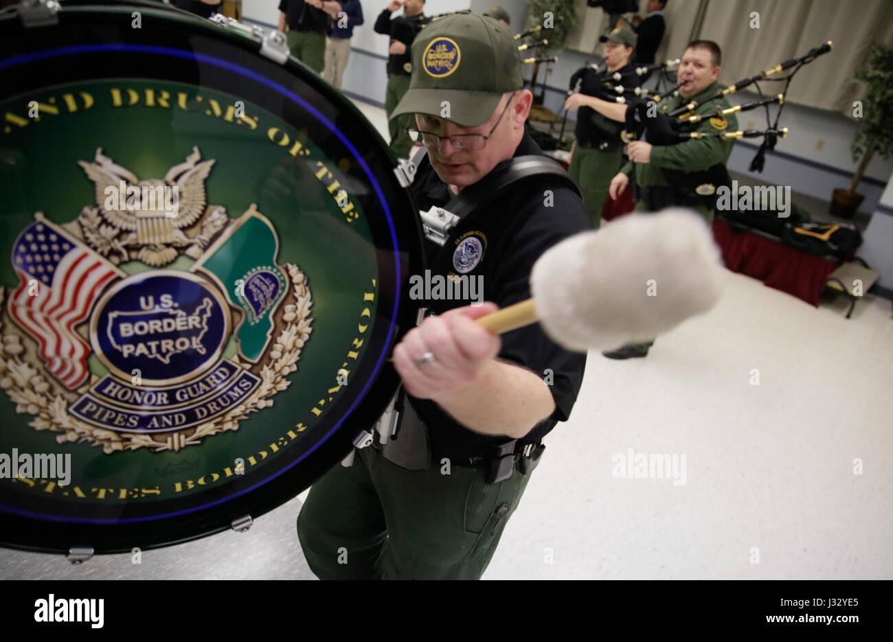 Members of the U.S. Border Patrol Pipes and Drums Band rehearse at the Woodbridge Elks Lodge in Dale City, Va., January 18, 2017, in preparation for the inauguration of the 45th President, Donald J. Trump. U.S. Customs and Border Protection Photo by Glenn Fawcett Stock Photo