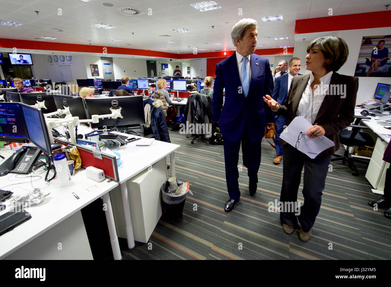U.S. Secretary of State John Kerry walks with CNN Chief International Correspondent Christiane Amanpour on January 16, 2017, at the CNN London Bureau in London, U.K., after an interview as he visited the British capital for meetings with the Archbishop of Canterbury and British Foreign Secretary Boris Johnson during the Secretary's final trip abroad as a Cabinet officer. Stock Photo