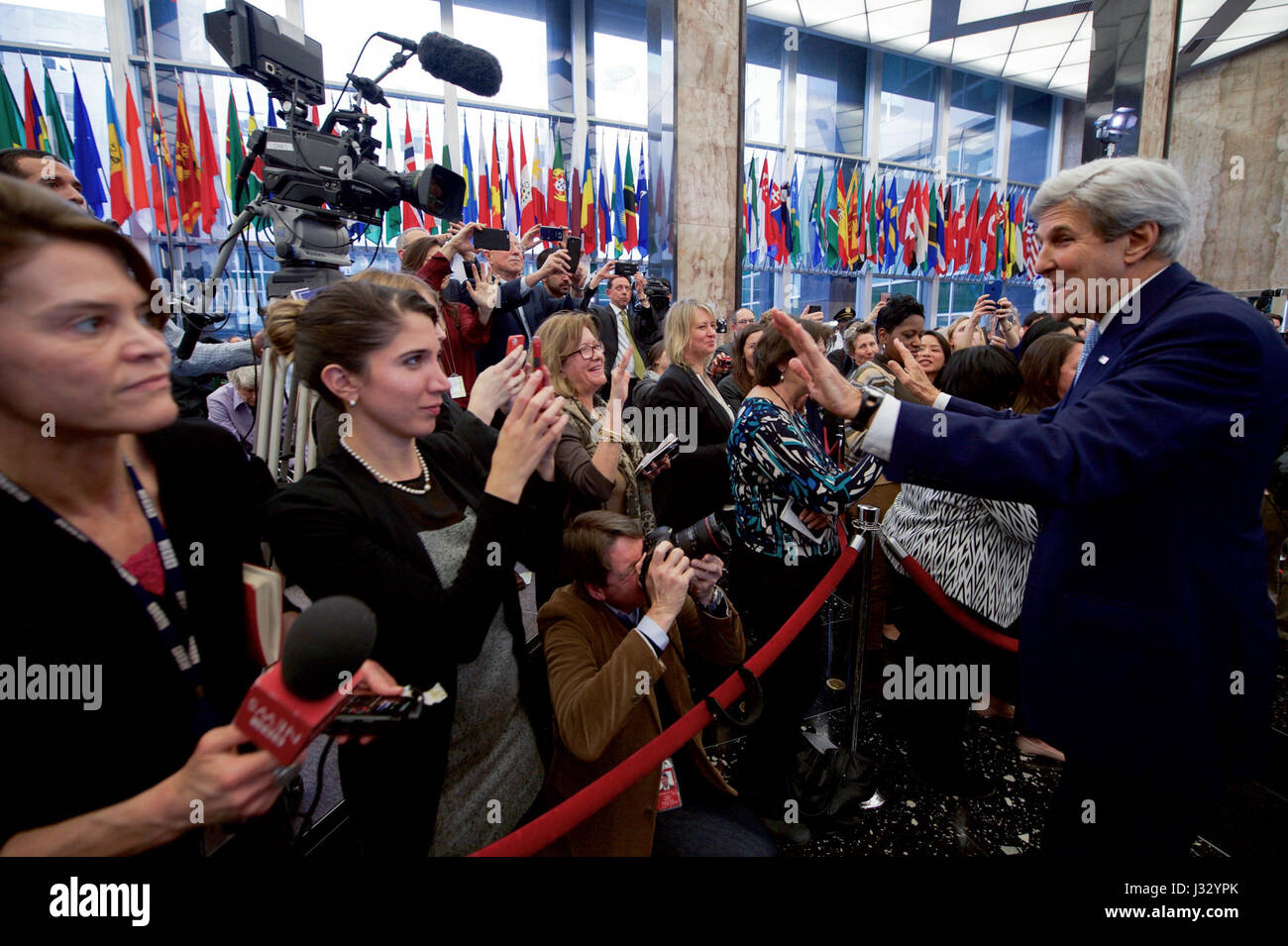 U.S. Secretary of State John Kerry acknowledges members of the Department's press corps as he departs the main lobby of the Department's Harry S. Truman Building after delivering farewell remarks to employees on January 19, 2017. Stock Photo