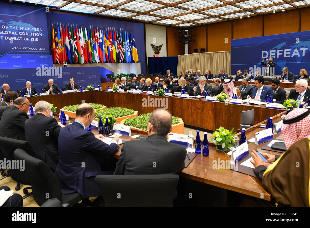 U.S. Secretary of State Rex Tillerson, flanked by Secretary of Defense James Mattis and Special Presidential Envoy for the Global Coalition to Counter ISIS Brett McGurk attends the afternoon Ministerial Plenary of the Global Coalition Working to Defeat ISIS at the U.S. Department of State in Washington, D.C. on March 22, 2017. Stock Photo