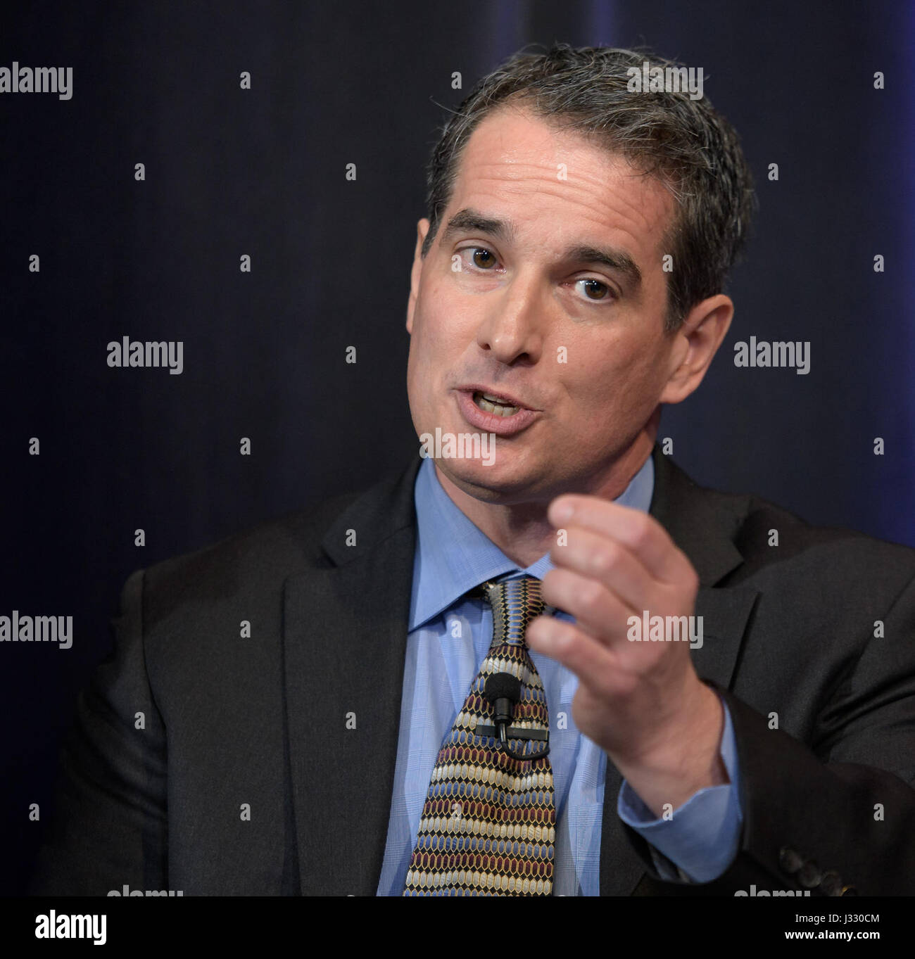 Manager of NASA's Spitzer Science Center at Caltech/IPAC, Pasadena, California Sean Carey presents research findings during a TRAPPIST-1 planets briefing, Wednesday, Feb. 22, 2017 at NASA Headquarters in Washington. Researchers revealed the first known system of seven Earth-size planets around a single star called TRAPPIST-1. Photo Credit: (NASA/Bill Ingalls) More: exoplanets.nasa.gov/trappist1/ ( https://exoplanets.nasa.gov/trappist1/ ) Stock Photo