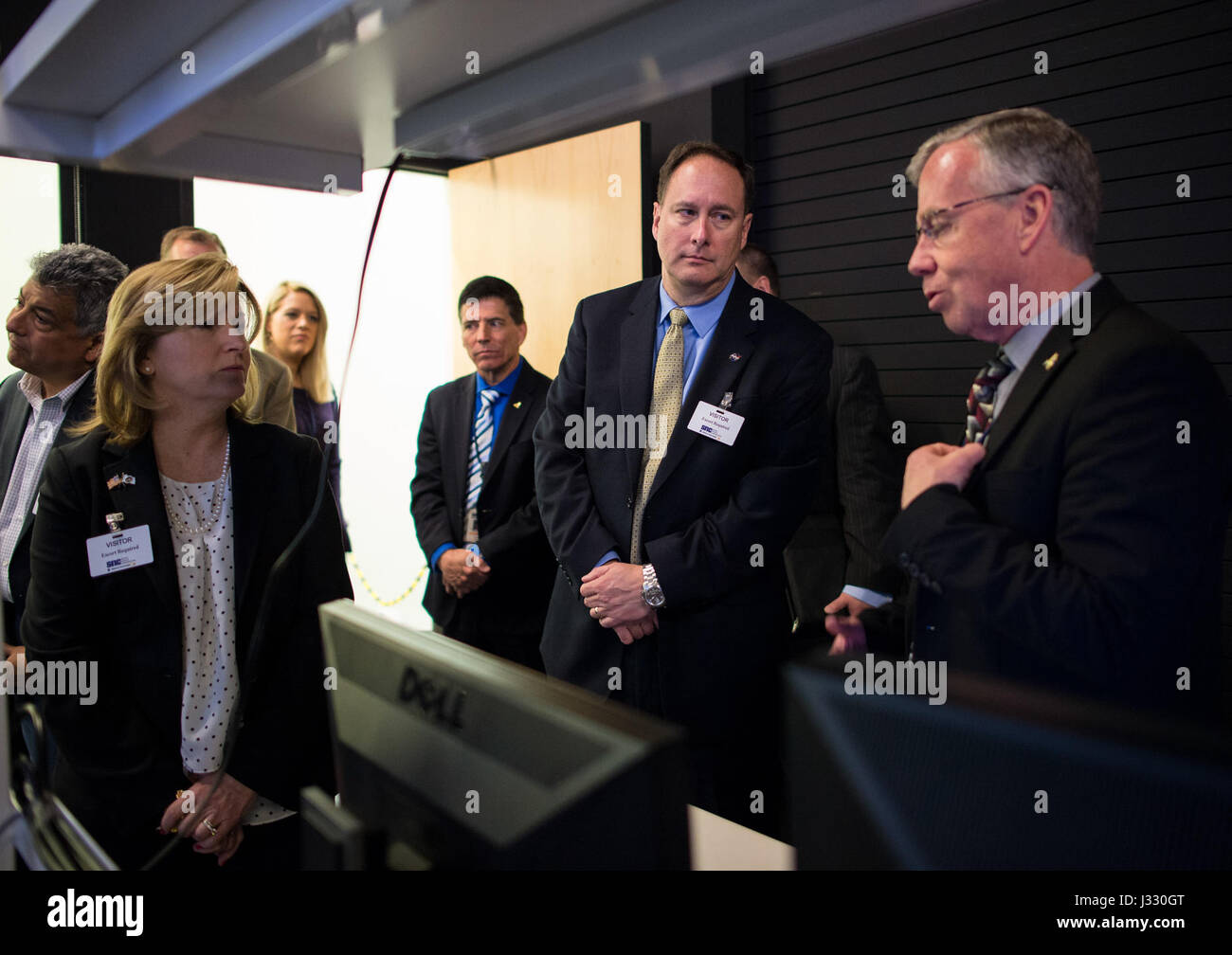 Vice President, Space Exploration Systems (SES) at Sierra Nevada Corporation Steve Lindsey, left, speaks with acting NASA Administrator Robert Lightfoot, center, and acting NASA Deputy Administrator Lesa Roe, left, about the Dream Chaser Space System simulator, Thursday, April 6, 2017 during a visit to Sierra Nevada Corporation in Louisville, Colo. Stock Photo