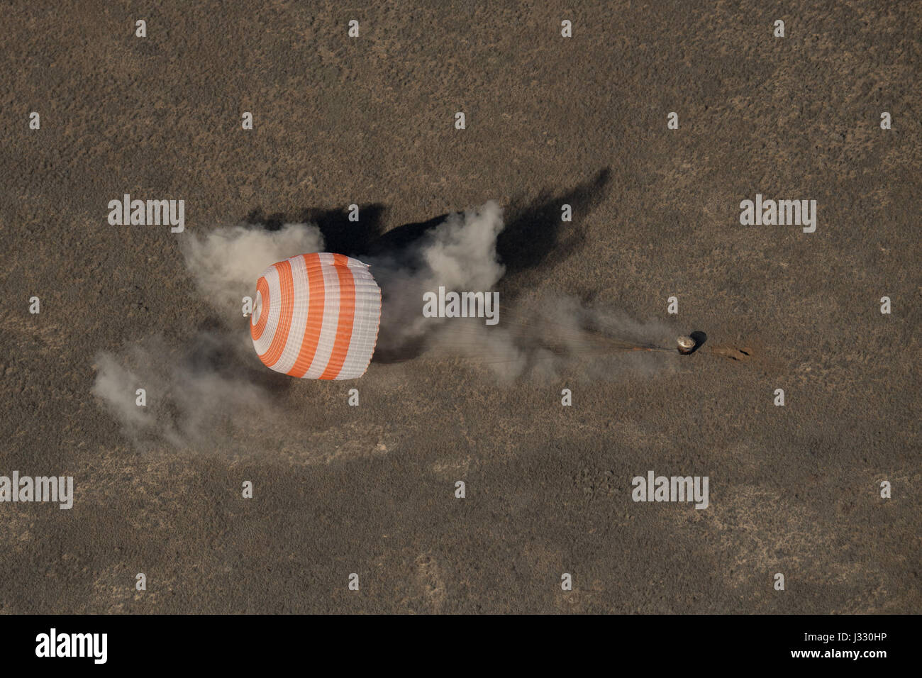 The Soyuz MS-02 spacecraft is seen as it lands with Expedition 50 Commander Shane Kimbrough of NASA and Flight Engineers Sergey Ryzhikov and Andrey Borisenko of Roscosmos near the town of Zhezkazgan, Kazakhstan on Monday, April 10, 2017 (Kazakh time). Kimbrough, Ryzhikov, and Borisenko are returning after 173 days in space where they served as members of the Expedition 49 and 50 crews onboard the International Space Station. Photo Credit: (NASA/Bill Ingalls) Stock Photo