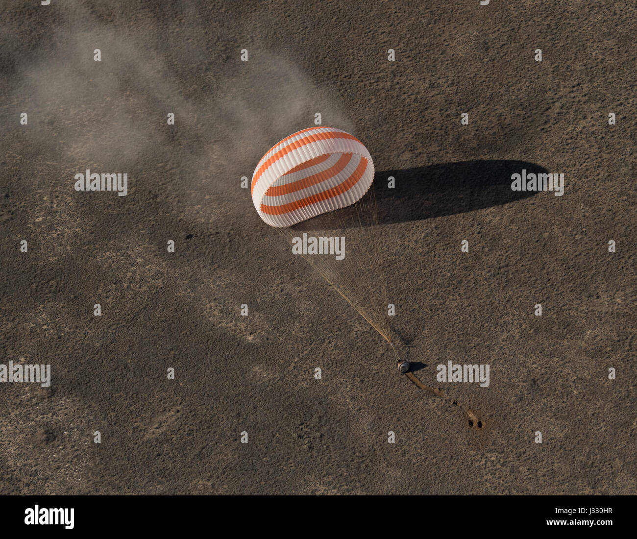 The Soyuz MS-02 spacecraft is seen as it lands with Expedition 50 Commander Shane Kimbrough of NASA and Flight Engineers Sergey Ryzhikov and Andrey Borisenko of Roscosmos near the town of Zhezkazgan, Kazakhstan on Monday, April 10, 2017 (Kazakh time). Kimbrough, Ryzhikov, and Borisenko are returning after 173 days in space where they served as members of the Expedition 49 and 50 crews onboard the International Space Station. Photo Credit: (NASA/Bill Ingalls) Stock Photo