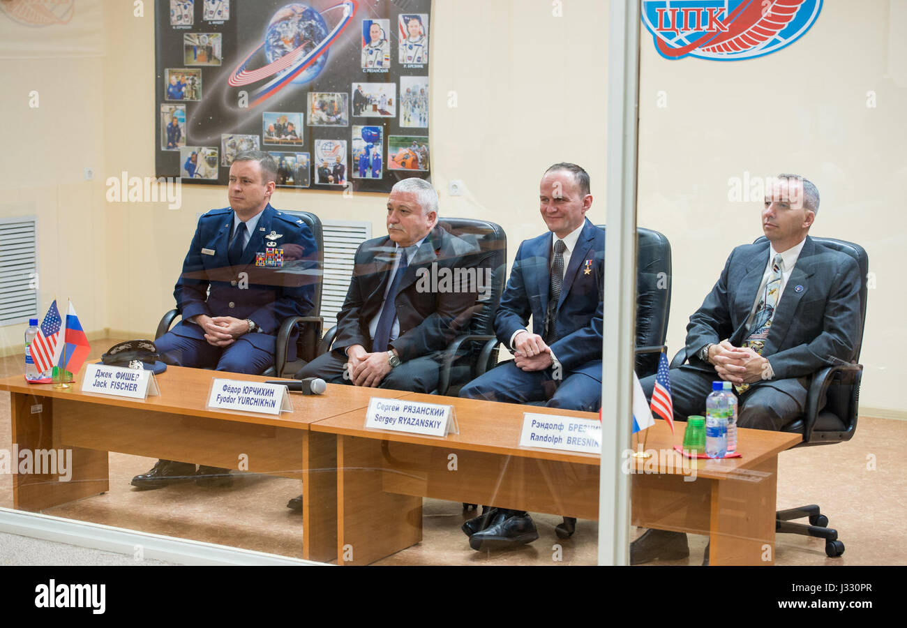 Expedition 51 prime crew members, Flight Engineer Jack Fischer of NASA, left, and Soyuz Commander Fyodor Yurchikhin of Roscosmos, second left, are seen with Expedition 51 back up crew members, Soyuz Commander Sergey Ryazanskiy of Roscosmos, second from right, and Flight Engineer Randy Bresnik of NASA, right at the State Commission meeting to approve the Soyuz launch of Expedition 51 to the International Space Station in Baikonur, Kazakhstan on Wednesday, April 19, 2017. The mission is set to launch April 20 from the Baikonur Cosmodrome. Photo Credit: (NASA/Aubrey Gemignani) Stock Photo