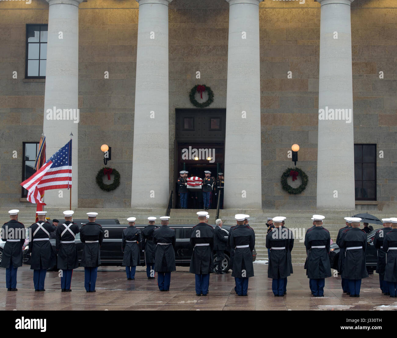 Former astronaut and U.S. Senator John Glenn's funeral procession is lead out of the Ohio Statehouse in Columbus, Ohio, Saturday, December 17, 2016. Stock Photo