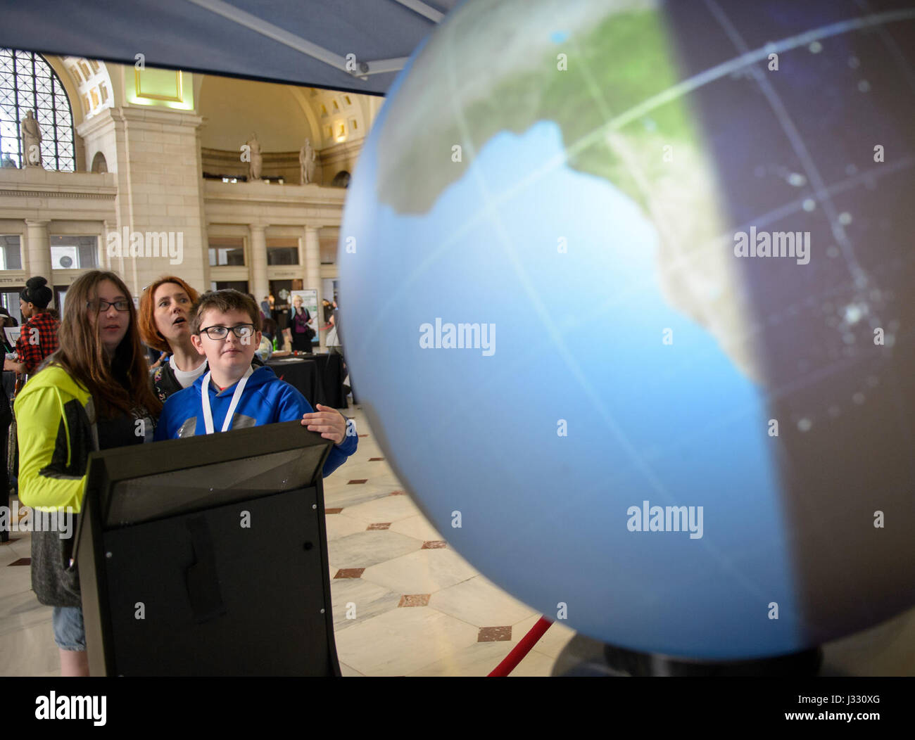 Visitors explore one of NASA's exhibits at the Earth Day event on Thursday, April 20, 2017 at Union Station in Washington, D.C. Stock Photo
