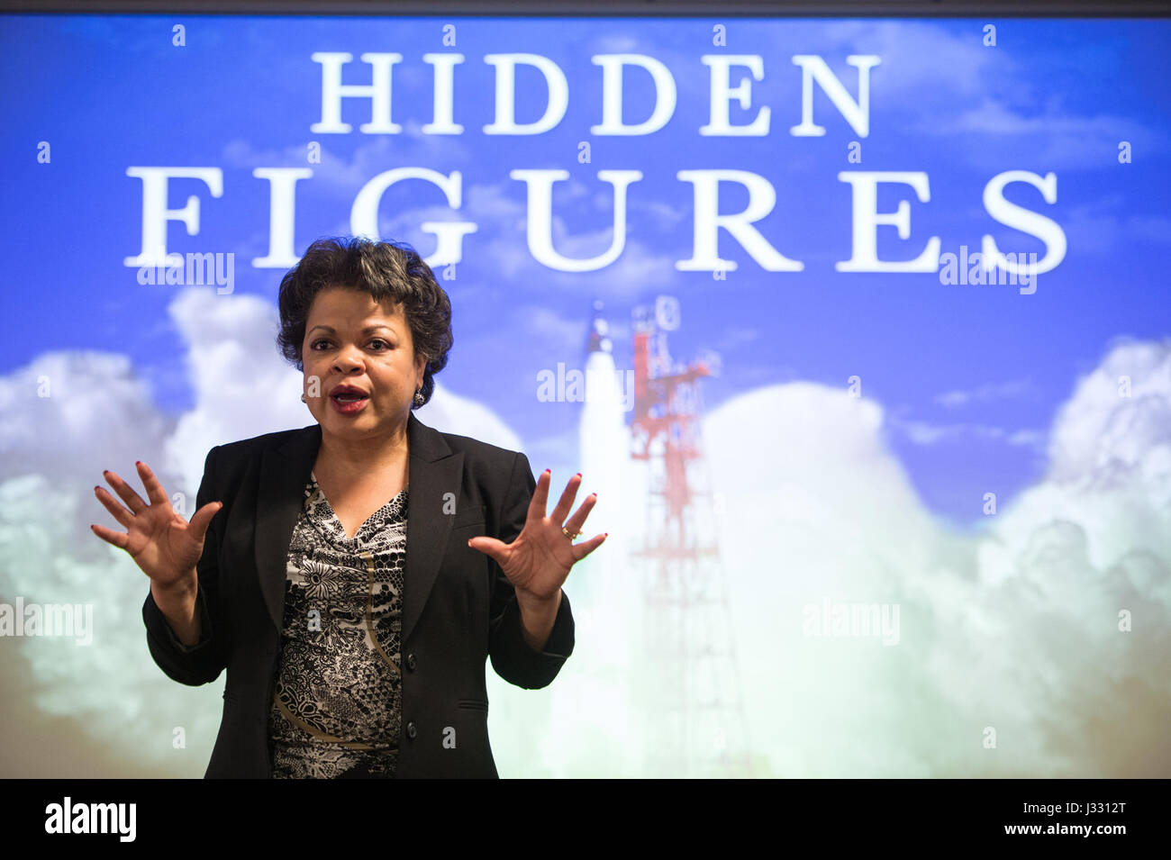 Janet Sellars, acting associate administrator for Diversity and Equal Opportunity at NASA Headquarters, speaks before &quot;Hidden Figures&quot; filmmaker Ted Melfi and author Margot Lee Shetterly are awarded the NASA Exceptional Public Achievement Medal by acting NASA Administrator Robert Lightfoot and NASA astronaut Alvin Drew, Wednesday, February 15, 2017 at NASA Headquarters in Washington. The &quot;Hidden Figures&quot; film was based on the book of the same title, by Margot Lee Shetterly, and chronicles the lives of Katherine Johnson, Dorothy Vaughan and Mary Jackson -- African-American w Stock Photo