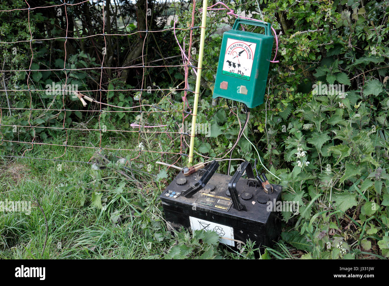 A car battery and electric fence in a field in Buckinghamshire, UK