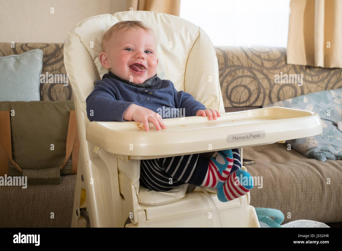 Seven Month old baby boy in a high chair, Devon, England, United
