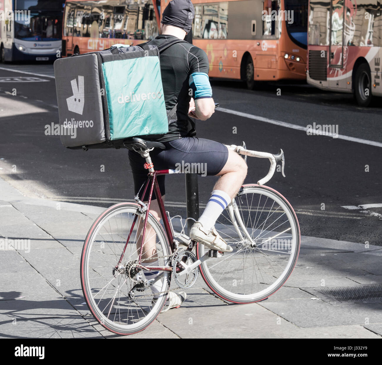 Deliveroo courier on bicycle in Newcastle upon Tyne. England, UK Stock