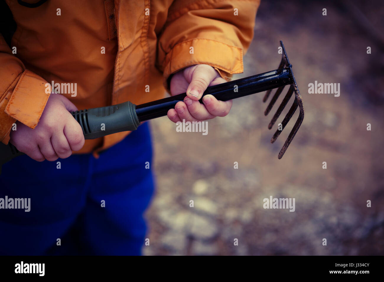 Child rake garden hi-res stock photography and images - Alamy