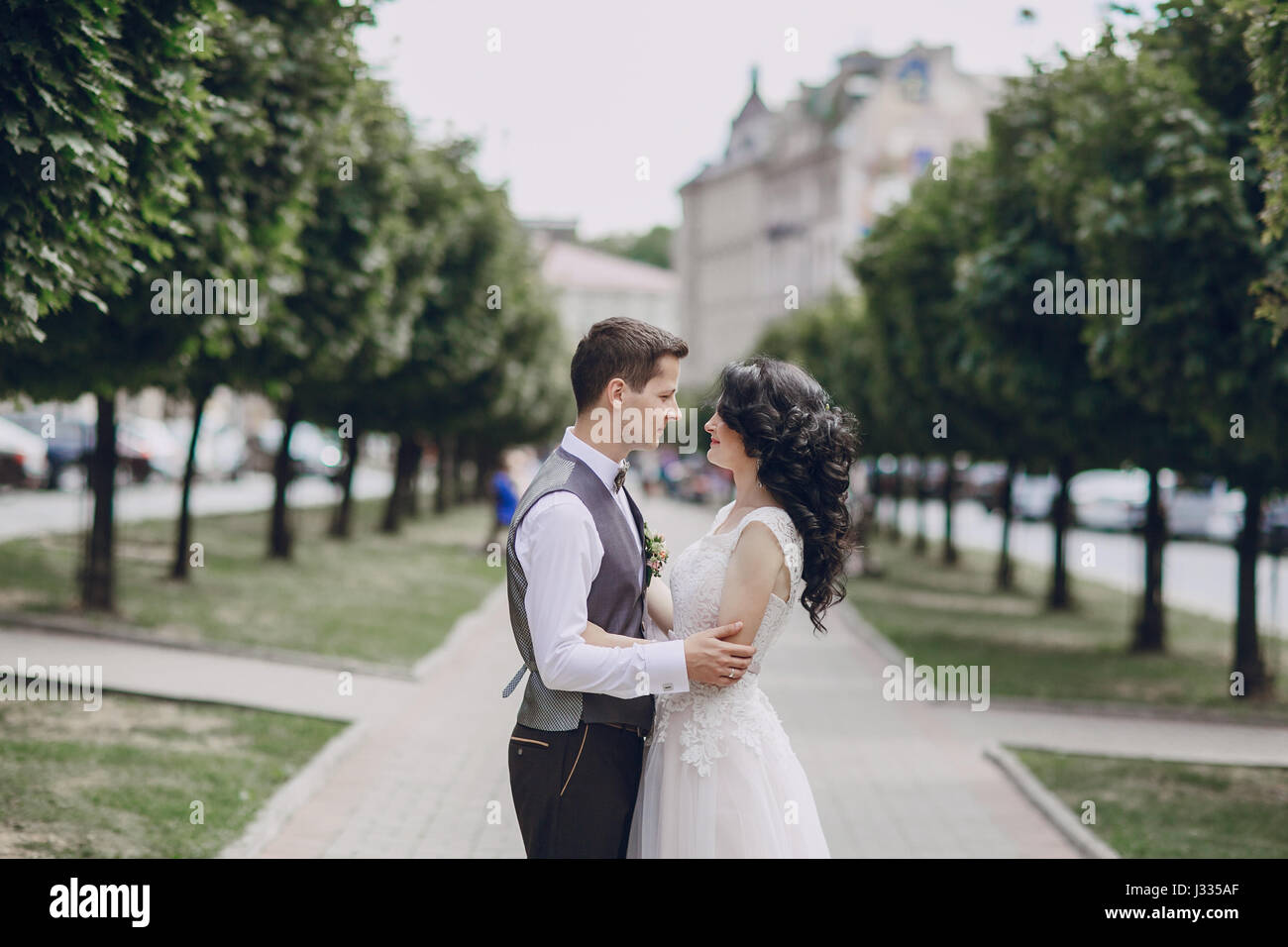 Bride groom walking in city hi-res stock photography and images - Alamy