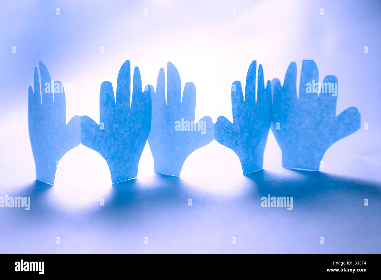 Paper hands in connection as friendship symbol Stock Photo Alamy