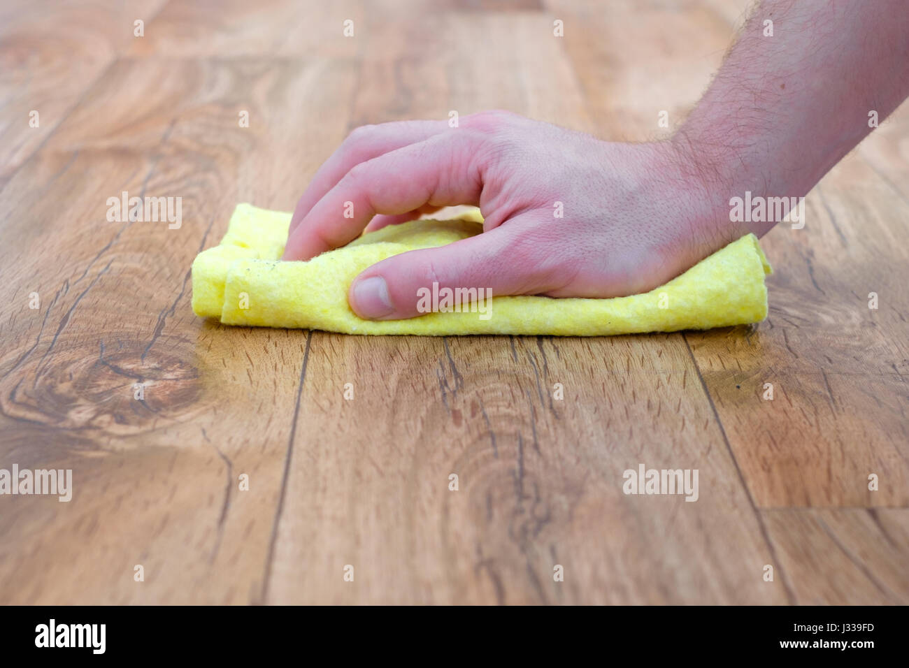 Detail of a hand with sponge cleaning a parquet floor Stock Photo Alamy