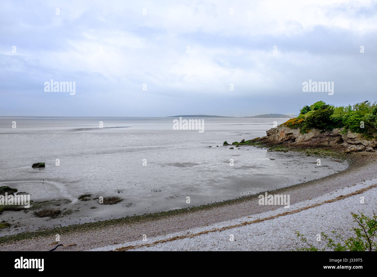 Cloudy day with the tide out at Morecambe Bay on the mud flats along the shore of Warton Sands, Far Arnside, Silverdale, Lancashire, England. Stock Photo