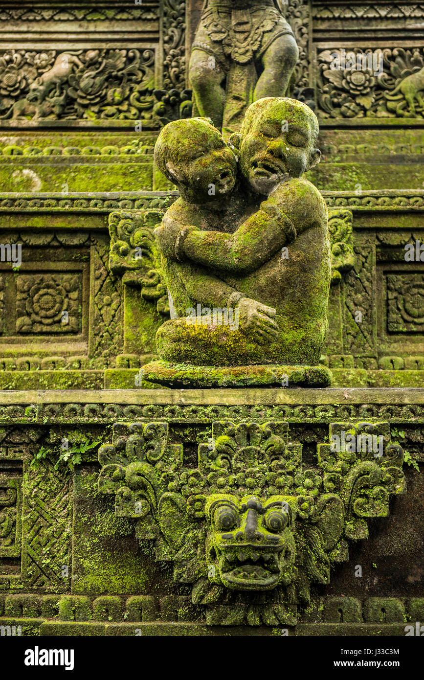 Balinese temple figures and monkey stone statues in the city of Temple Ubut, Bali, Indonesia Stock Photo