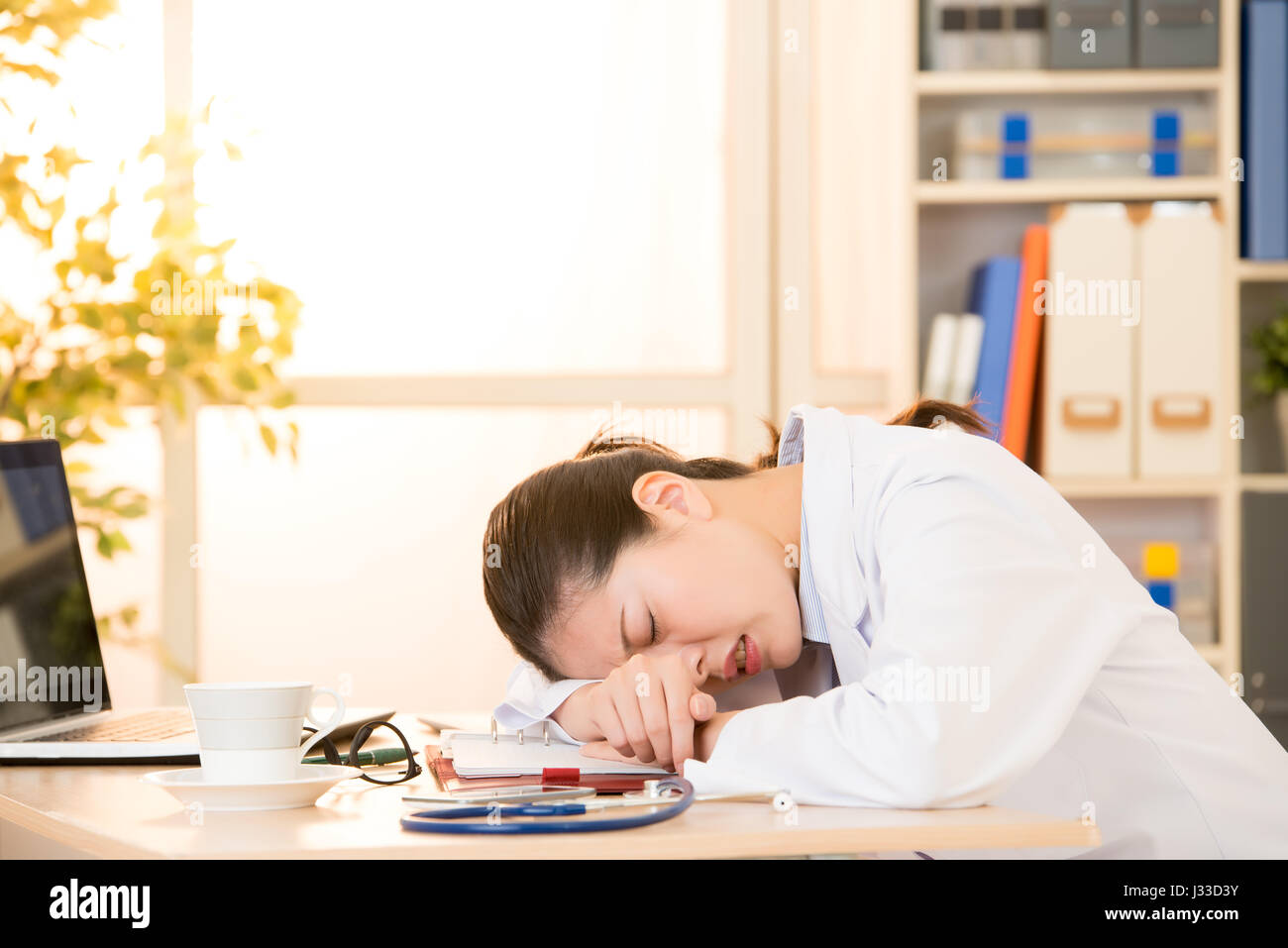 Woman Doctor Feel Painful Suffering Head Face Lie Down On Desk In