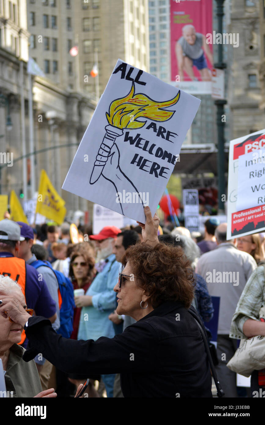 Signs at a May Day rally in New York City Stock Photo