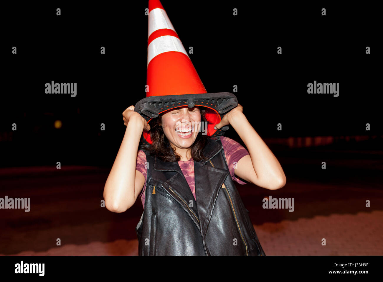 Traffic cone on head hires stock photography and images Alamy