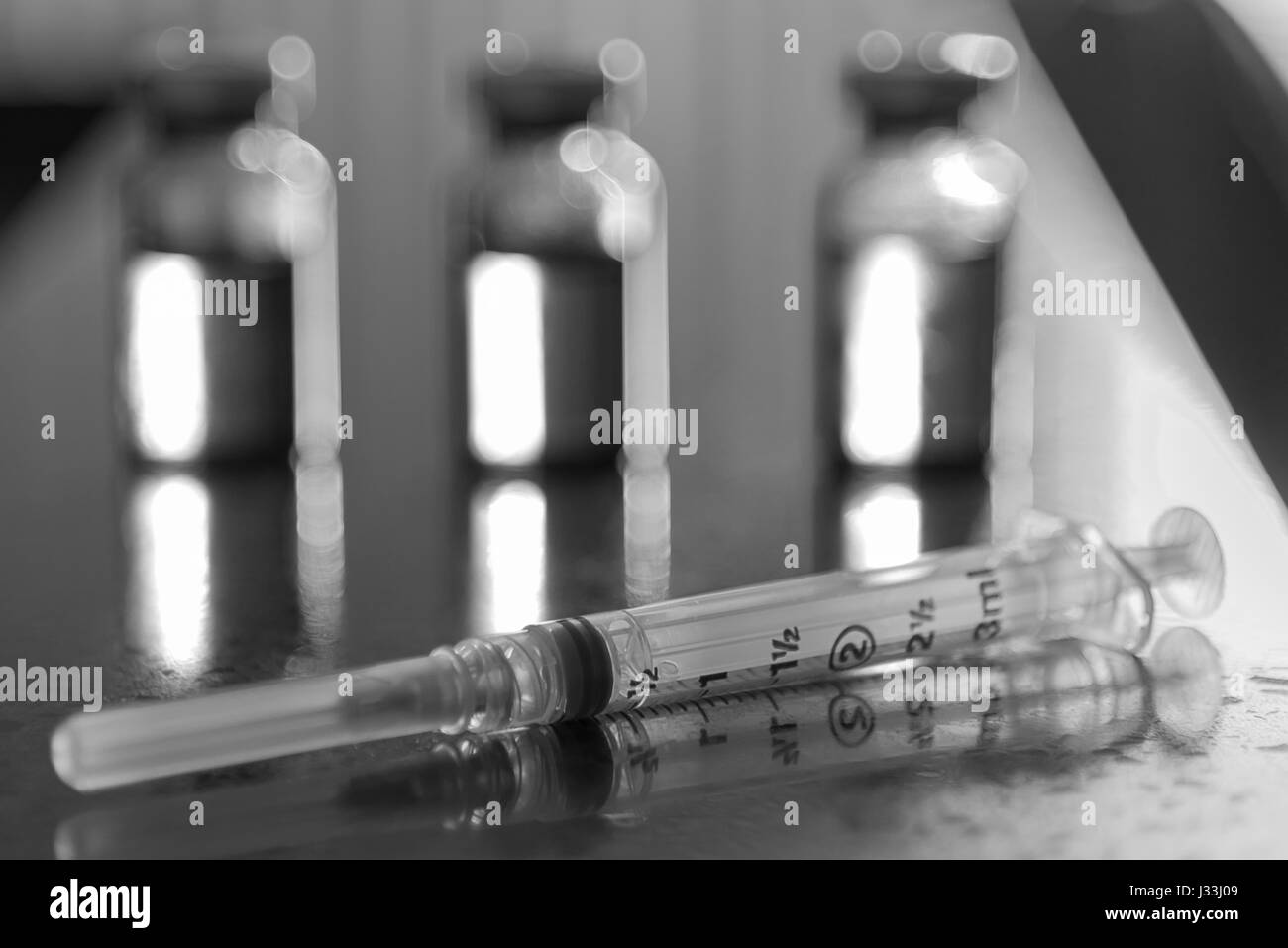 Vials of medicine and syringes Stock Photo