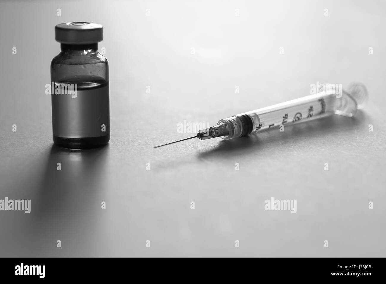 Vials of medicine and syringes Stock Photo