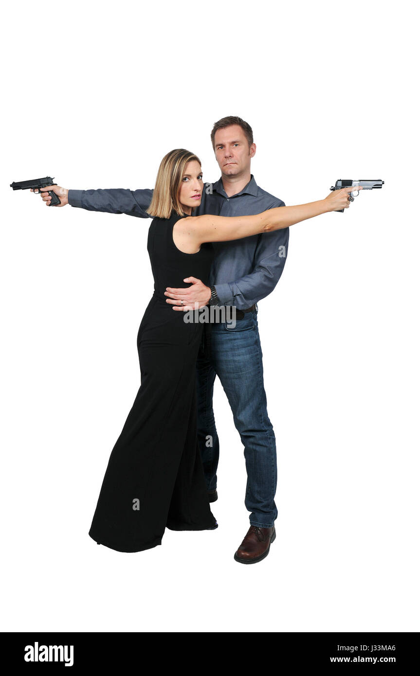 Man and woman secret agent spies with guns Stock Photo