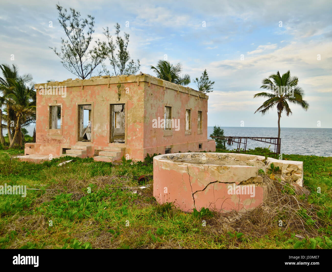 Abandoned lighthouse keeper house and well, in Gun Cay, in Bahamas. Stock Photo
