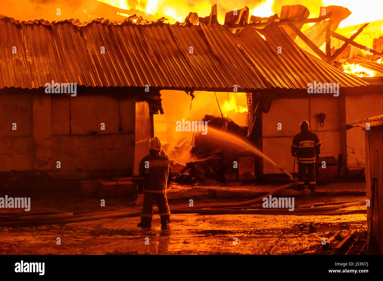 Firefighters extinguish a fire Stock Photo Alamy