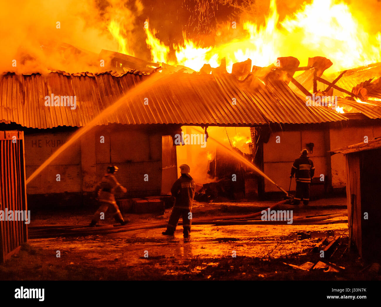 Firefighters extinguish a fire Stock Photo - Alamy