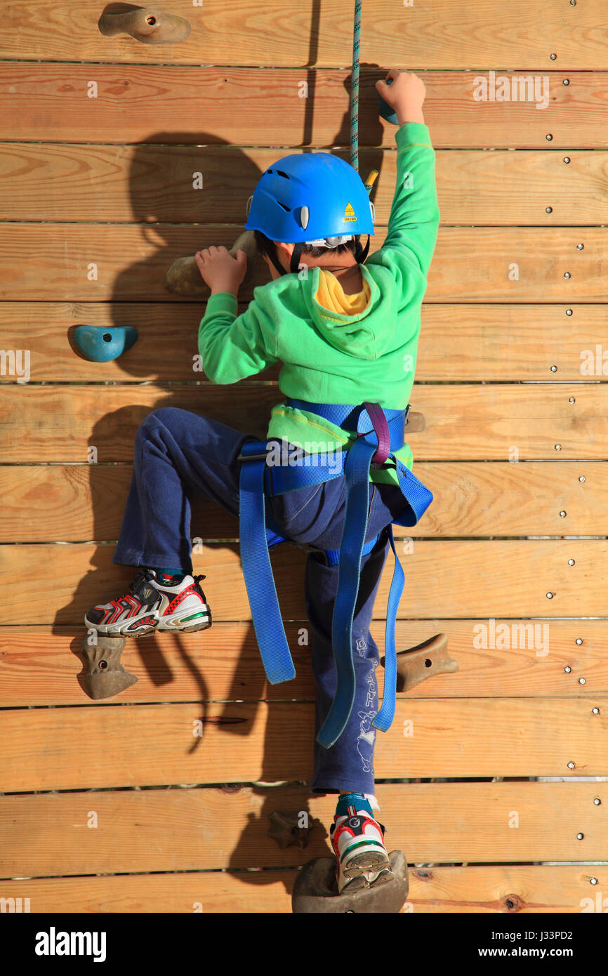 Boy climbing wall harness hi-res stock photography and images - Alamy