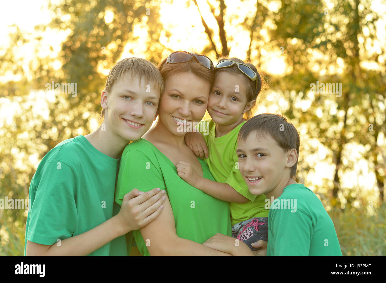 Happy parents with children  outdoors Stock Photo