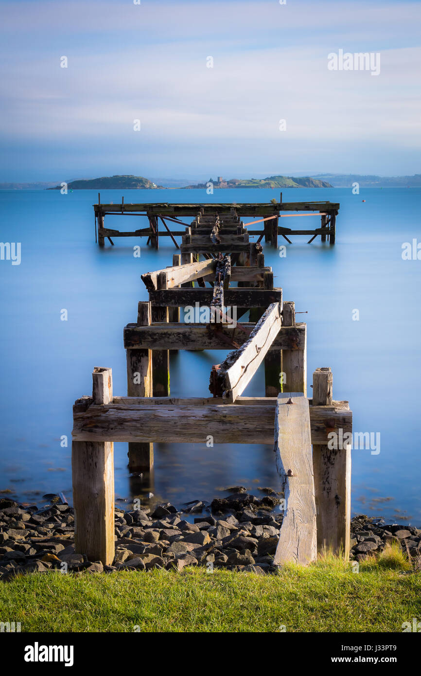 wooden pier in the coastal village of Aberdour, Scotland Stock Photo
