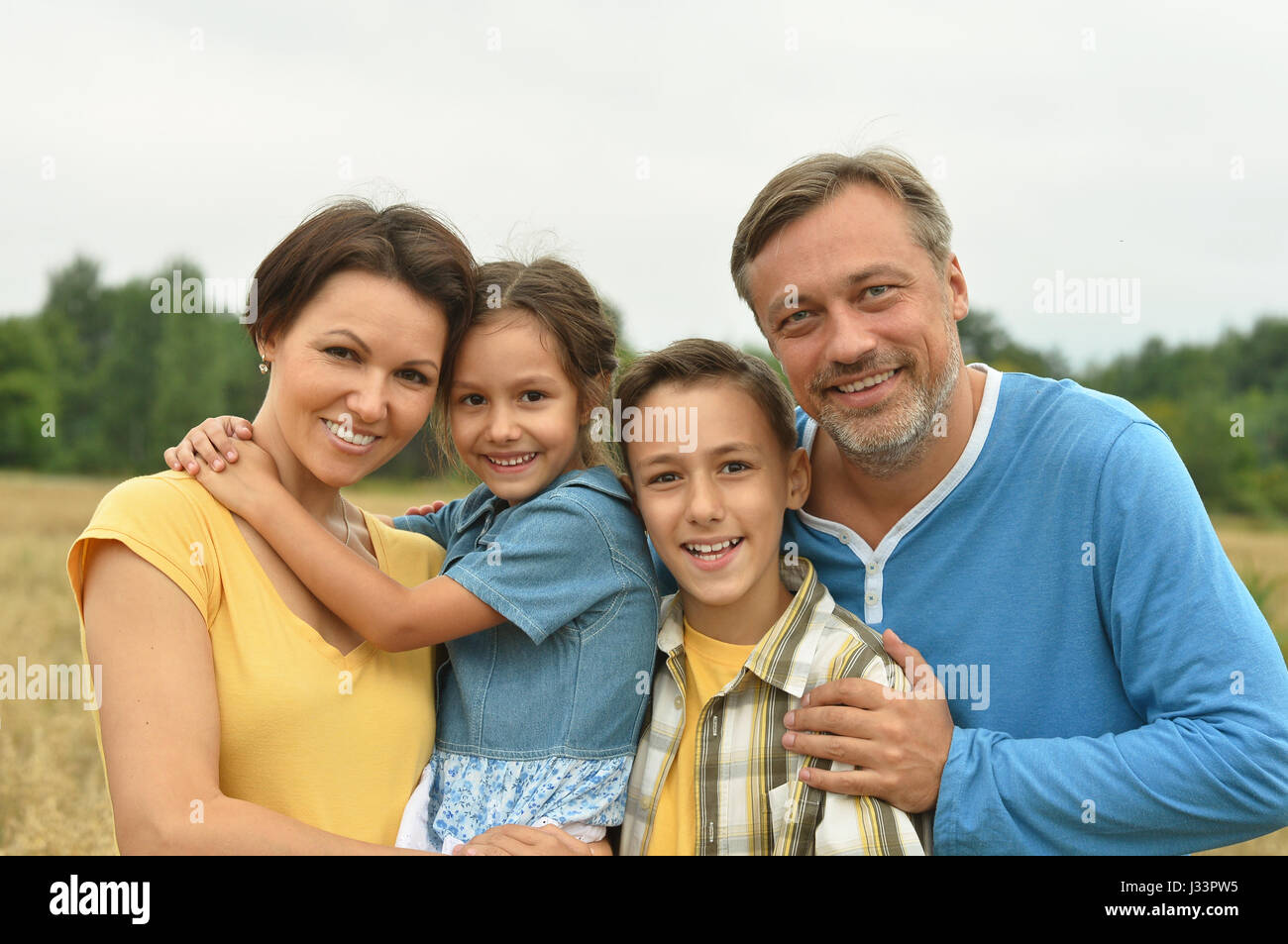 Happy parents with children  outdoors Stock Photo
