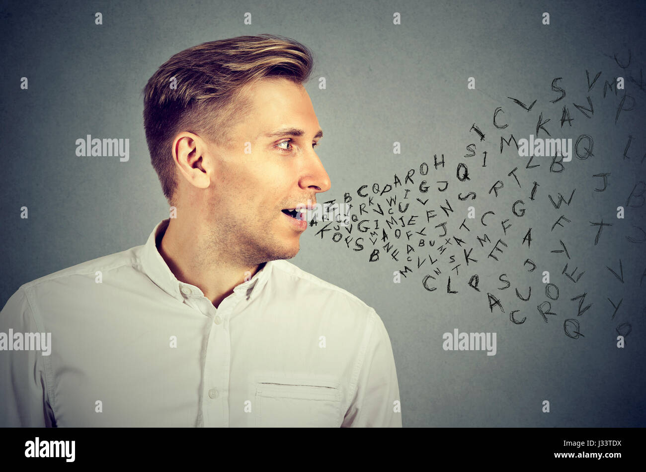 Man talking with alphabet letters coming out of his mouth. Communication, information, intelligence concept Stock Photo