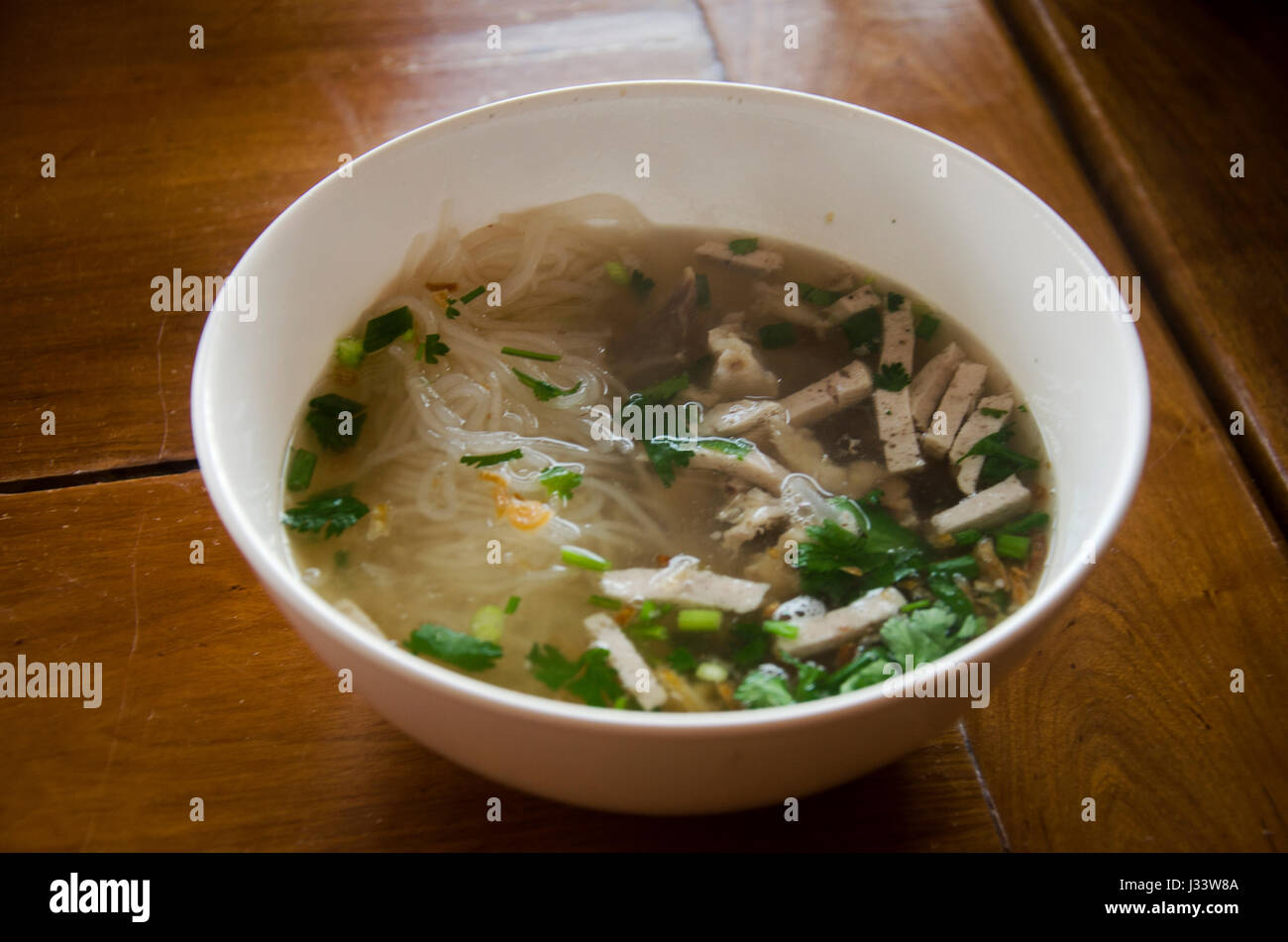 Vietnamese noodle soup with meat called Pho served with vegetable for