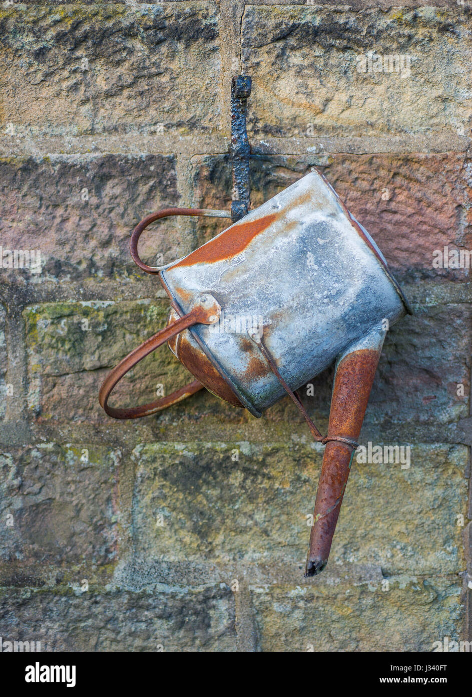 Old tin watering can, Whitewell, Clitheroe, Lancashire. Stock Photo