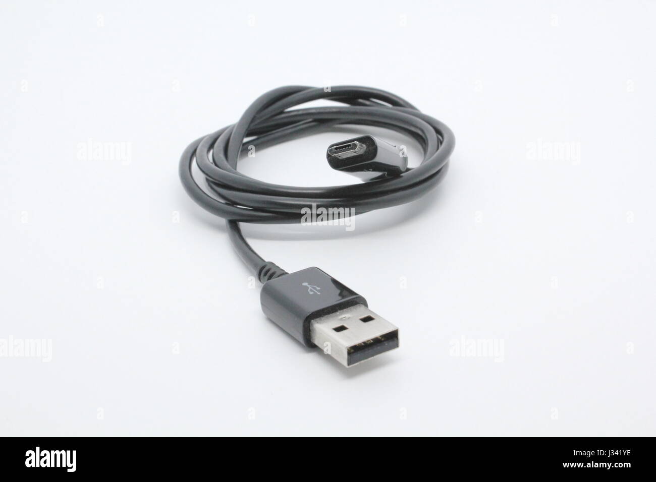 Black USB and micro USB cable isolated on white background Stock Photo