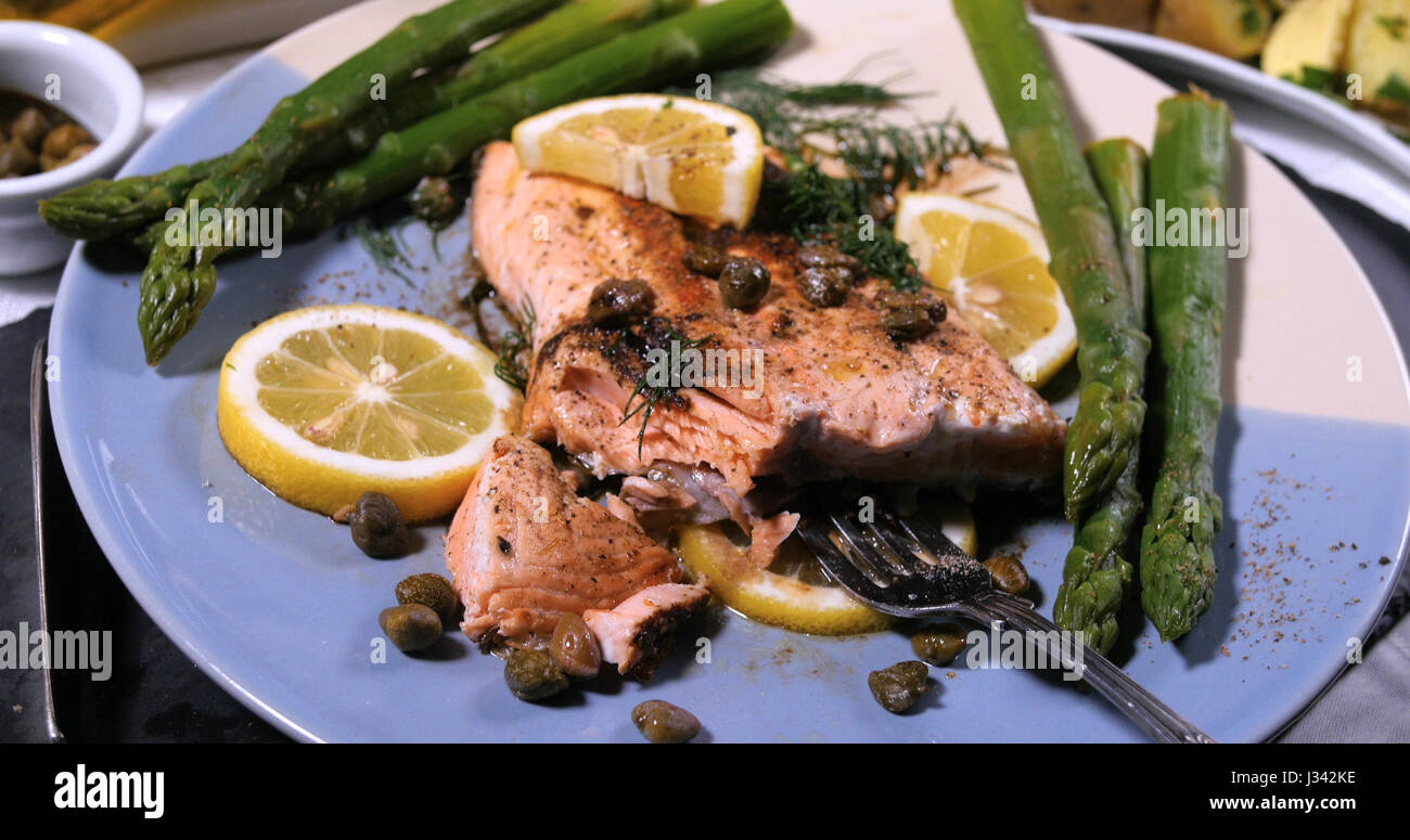 Close up view of a delicious roasted organic salmon with capers and dill Stock Photo