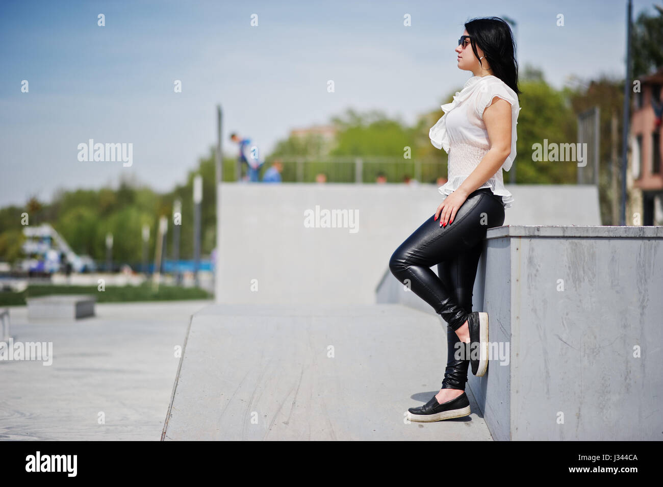 white blouse leather pants
