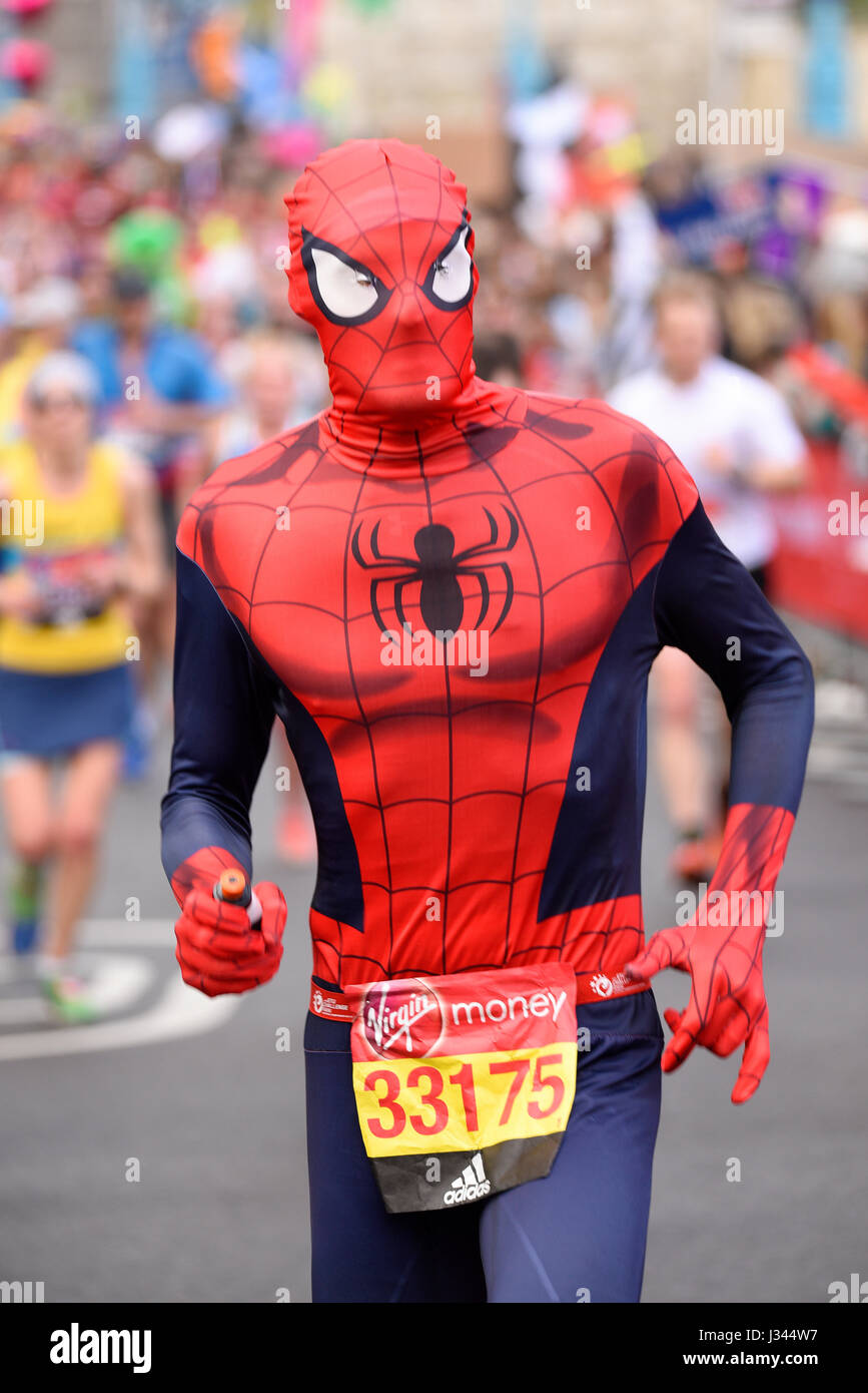 John Mason running in a Spiderman costume in the 2017 London Marathon near  Tower Bridge, with space for copy Stock Photo - Alamy