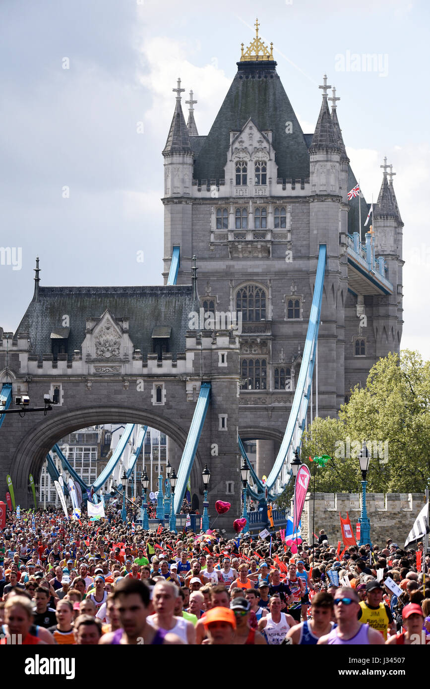 Masses of fun runners running in the 2017 London Marathon near Tower Bridge Stock Photo