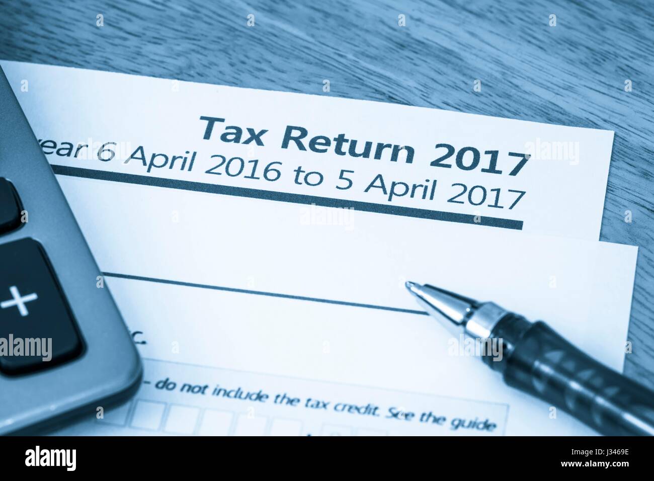 Cool toned image of UK income tax return form for 2017 Stock Photo